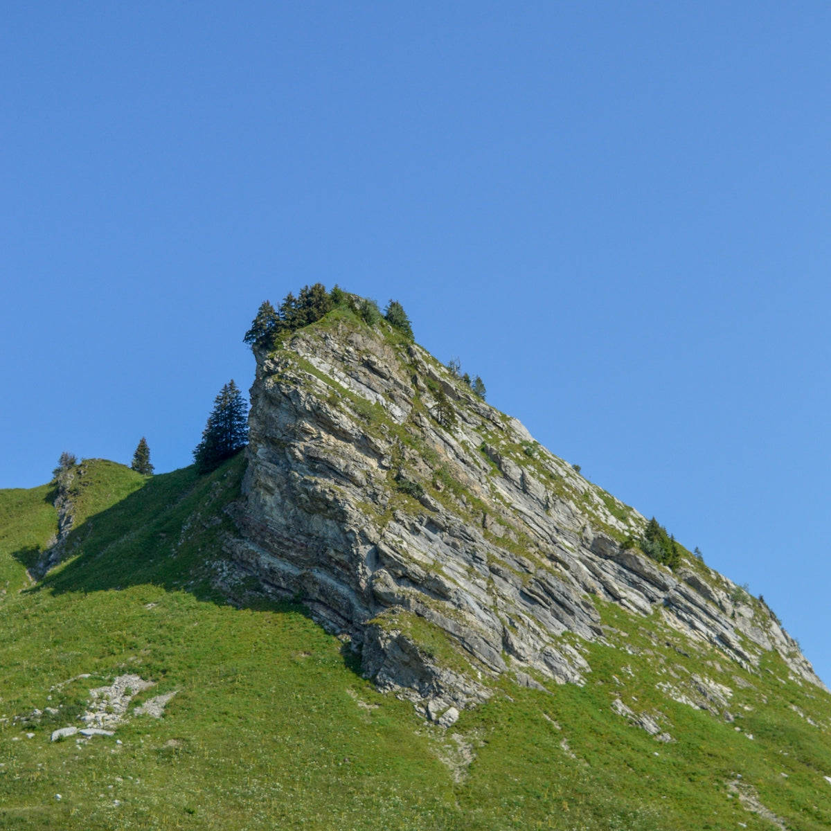 green and gray rocky mountain under blue sky during daytime
